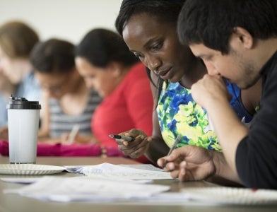 students conversing at table 