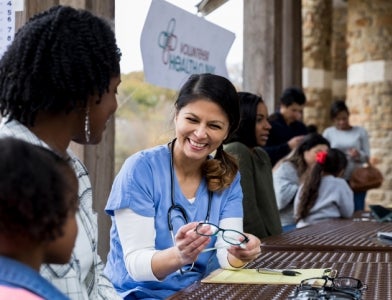 Female doctor helping family