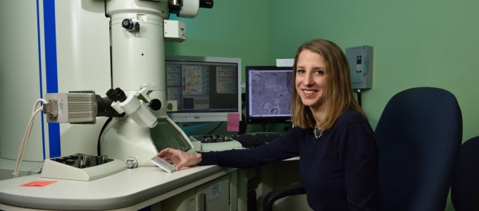 woman working with microscope 