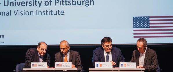 From left to right: Sahel and Shekhar at the signing with Didier Samuel and Serge Picaud.