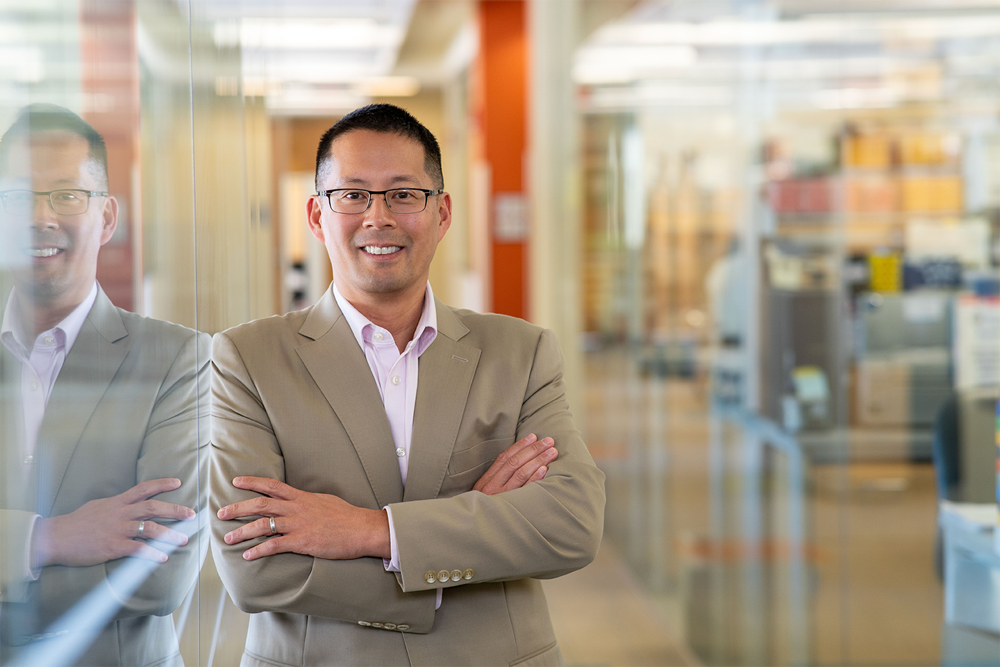  Stephen Chan smiling for a photo in his lab.